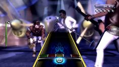 an image of two people playing guitar hero