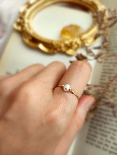 ✨ Tiny Freshwater Pearl Ring with choices of 14K Gold Filled, Rose Gold Filled or 925 Sterling Silver, June Birthstone Gift 💙 Dainty stacking ring with one small pearl. Make a very cute pinky ring. *Pearl Size: 4 mm *Ring Band: 0.8 mm ✨ Pearl symbolizes modesty, innocence & purity. Pearl is believed to offer protection, as well as attract good luck & wealth ✨ * Handmade in your ring size with 14K gold-filled or Sterling Silver wire and Natural Freshwater Pearl. * 14K gold-filled wire is known f 14k Gold Filled Open Rings For Wedding, Hypoallergenic 14k Gold Filled Wedding Rings, Wedding Open Rings In 14k Gold Filled, 14k Rose Gold Filled Stackable Rings For Wedding, 14k Gold Filled Round Band Jewelry Gift, 14k Rose Gold Filled Stackable Wedding Rings, Elegant Adjustable 14k Gold Filled Rings, 14k Gold Filled Rings For Gift, Elegant 14k Gold Filled Promise Ring