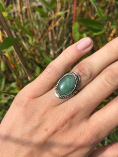 "Adjustable alpaca silver rings with green Jade gemstone for cleansing and protection. These green crystal rings are handmade with ♡ in Peru. Rings are adjustable to every ring size! More ethnic (gemstone) rings: https://www.etsy.com/shop/IluminaCamino/?section_id=25291253 DIMENSIONS Average stone size is 1.8 x 1.2 cm (0.7 x 0.5\") ALPACA SILVER Alpaca silver is a high quality metal alloy typically used for jewellery-making in Central and South American countries. This durable material is very e Jade Gemstone Rings For Healing, Adjustable Green Jade Rings, Jade Jewelry With Natural Stones, Jade Ring With Natural Stones, Green Crystal Ring With Large Stone For Gift, Bohemian Green Crystal Round Ring, Green Bohemian Crystal Ring, Green Jade Rings With Natural Stones, Green Large Stone Ring Jewelry