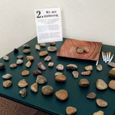 some rocks are on a table with a sign