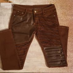 These Are The Coolest Jeans/Pants. There Is A Mixture Of Materials Leather/Suede, Zippers On Left Knee And Rhinestones For Closure Button And Rhinestone Accents On Back Pockets. I Have My Own Pair And I Always Get The Most Compliments. Edgy Fitted Brown Bottoms, Edgy Brown Fitted Bottoms, Edgy Jeans With Zipper Closure For Fall, Leather Bottoms With Side Zipper For Fall, Edgy Brown Bottoms For Fall, Casual Leather Pants With Zipper Closure, Leather Jeans For Fall With An Edgy Style, Trendy Brown Bottoms With Zipper Closure, Brown Denim Pants For Fall