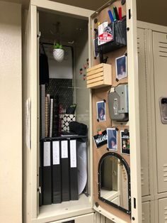 an open locker with pictures and other items on it