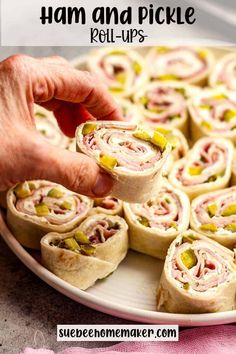 ham and pickle roll - ups on a plate