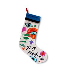 a christmas stocking with an eye and flowers on it