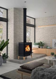 a living room filled with furniture and a fire place in the middle of it's wall