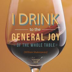 a wine glass with the words i drink to the general joy of the whole table