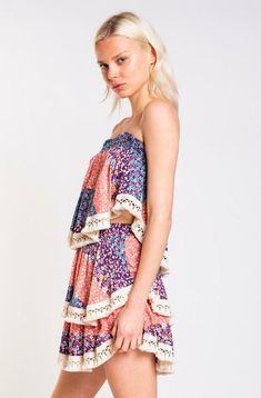 STYLE INFORMATION: You're going to look so sweet in the Summer Fields Blue and Blush Floral Print Strapless Two-Piece Set! This cute head-turner, shaped from woven fabric, features a patchwork floral print ( in hues of blush, blue, and purple, and ivory) across a smocked strapless ruffle bodice and tiered mini skirt. Crochet lace trim detail decorates ruffle hem. Lined. DETAILS & CARE: Rayon. Machine Wash Cold. Imported. SHIPPING: We offer free shipping for all orders in the Continental US. Mini Skirt Crochet, Blush Floral Dress, Summer Fields, Crop Top Mini Skirt, Skirt Crochet, Tiered Mini Skirt, Crochet Lace Trim, Pink Boho, Dress Set