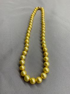 Gold Freshwater Pearl Necklace. This hand knotted strand features 47 Gold Freshwater Pearls AAA High Luster round 8.4-9.4 mm yellow overtones finished with a 8mm polished 14K Yellow Gold Filled bead clasp. This necklace measures 17 1/4 inches in length. I hand knotted this necklace with gold silk thread. These are genuine pearls, they are color enhanced, they are well matched with a few minor surface blemishes. The necklace pictured is the one you will receive, we hand craft our pieces one at a Corpus Christi Tx, Gold Pearl Necklace, Pearl Choker Necklace, Hand Craft, Freshwater Pearl Necklace, Gold Silk, White Freshwater Pearl, Dark Gold, Pearl Choker