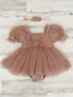 This listing is for a dusty rose (vintage pink) tutu dress, and your option of matching headband!  Perfect for that 1st birthday!!  ~headband elastic can be made in any color! ~ ships within 1 to 3 business days (message me with any additional questions)! ~ headband backed with felt for comfort {{SIZING}}  6-9 months (fits 18-20 lbs.) 9-12 months (fits 20-22 lbs.) 12-18  months  (fits 22-26 lbs.) 18-24 months  (fits 26-30 lbs.)  Don't forget to like my Facebook page for 10% off coupon https://ww Boho Cake, Baby Girls Dresses, Pink Tutu Dress, First Birthday Dresses, Girl Tutu, Cake Smash Outfit, 1st Birthday Outfits, Pink Tutu