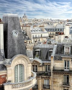 an aerial view of the roofs and windows of buildings in paris, france with blue sky