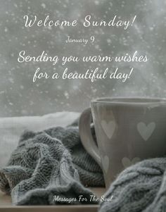 a coffee cup sitting on top of a window sill next to a gray blanket