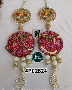 the earrings are decorated with beads and tassels