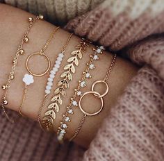 Elevate your style with our stunning Boho Chic Gold & White Bracelet Set. This versatile 6-piece collection is the perfect blend of elegance and free-spirited charm, making it a must-have accessory for any bohemian soul. What's Included: 6 Unique Bracelets: A carefully curated mix of gold and white bracelets, each with its own distinctive design. The set includes a combination of delicate chains, beaded strands, and textured bands, allowing you to create endless style combinations.    Features: قلادات متدلية, Leaf Bracelet, Tassel Bracelet, Jewelry Accessories Ideas, Classy Jewelry, Fancy Jewellery, Hand Chain, Fancy Jewelry, Geometric Jewelry