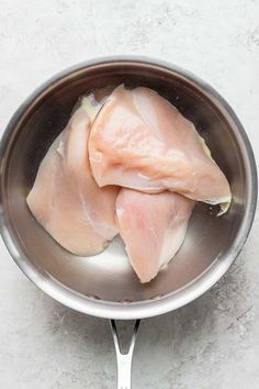 raw fish fillets in a saucepan ready to be cooked