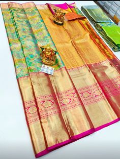 "The saree is made of pure silk kanjeevaram/kanchipattu with gold zari, Pallu, and blouse. Various Colours Available, please see photos. Mention desired colour in \"Optional Note\" when purchasing saree. ❗️❗️❗️PLEASE CONTACT SELLER TO CONFIRM COLOUR COMBINATION FOR AVAILABILITY ️❗️❗️ Upon request: Tussels, fall and pico and blouse work (Aari work and Maggam work) will be done with extra charges  Excellent quality with beautiful colours and combinations." Kanchipattu Sarees, Orange Tussar Silk Pre-draped Saree With Pallu, Luxury Orange Meenakari Saree, Festive Yellow Tussar Silk Pre-draped Saree, Festival Meenakari Pre-draped Saree In Tussar Silk, Festival Yellow Tussar Silk Pre-draped Saree, Organza Blouse, Maggam Work, Blouse Work