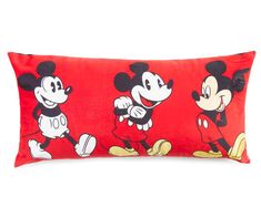 a red pillow with mickey and minnie mouses on it