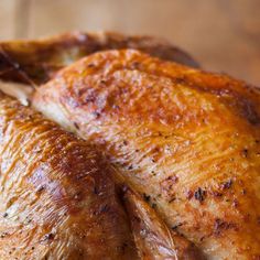 a close up of a turkey on a wooden table