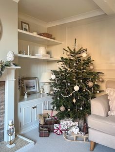 a living room with a christmas tree in the corner