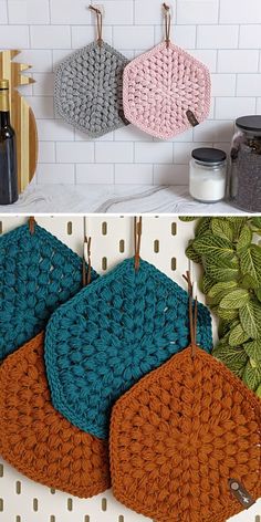 crocheted potholders hanging from hooks on the wall next to plants and jars