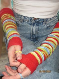 a person wearing a red and yellow striped arm warmer