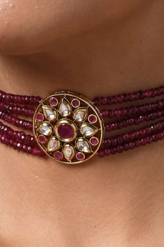 This choker boasts of rich red stones with a floral kundan unit at the centre. This piece made to wrap beautifully aound your neck is replete with traditionality and contemporary charm. Necklace Closure - Adjustable Dori Style Tip - Being a strong supporter of the intersection of classic and contemporary, we love designs that are contemporary yet boast hints of traditional charm. This choker can be a great pair for traditional sarees, indo-western dresses or even a power suit. Handcrafted in Jam Red Kundan Necklace With Round Beads In Temple Style, Red Beaded Kundan Necklace In Temple Style, Red Ruby Kundan Necklace For Diwali, Red Round Beads Kundan Necklace For Festivals, Red Kundan Necklace With Round Beads For Festivals, Red Ruby Necklace With Tilla Details, Red Kundan Necklace With Stone Work For Puja, Red Kundan Necklace Gemstone Gift, Red Kundan Necklace With Gemstones As Gift