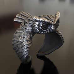 Embrace the wisdom of the night with our enchanting Owl Silver Ring. This handcrafted 925 sterling silver piece features a detailed owl design, symbolizing wisdom, intelligence, and the mysteries of the night. This unique, unisex ring is perfect for nature enthusiasts, animal lovers, or anyone who appreciates the magic and beauty of owls. The intricate craftsmanship and polished finish make it a captivating accessory for any occasion. Available in various sizes for men and women. Carry the spiri Cool Owl Rings For Men, Owl Wax Seal Ring, Owl Accessories, Owl Ring, Silver Owl, Animal Rings, Owl Design, Nature Inspired Jewelry, Handmade Rings