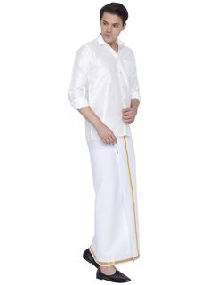 Vastramay Men's White Cotton Silk Blend Shirt and Dhoti Set The Vastramay Men's White Cotton Silk Blend Shirt and Dhoti Set combines traditional charm with contemporary comfort, ideal for festive and ceremonial occasions. Features of Vastramay Men's White Cotton Silk Blend Shirt and Dhoti Set Crisp white color for a classic look. Made from a luxurious blend of cotton and silk for a smooth and soft feel. Traditional design with modern appeal. Shirt features a classic collar and button-down front.