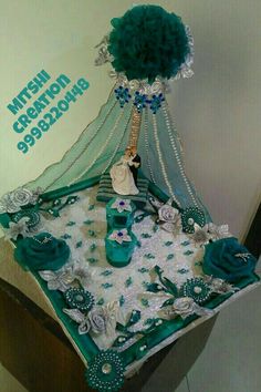 a cake with green and white decorations on it's sides, sitting on top of a table