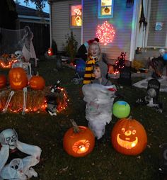 a group of people with pumpkins in front of a house decorated for western christian halloween