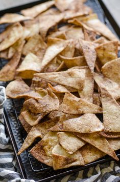 a tray filled with potato chips on top of a table