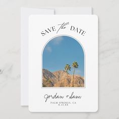 save the date card with palm trees and mountains