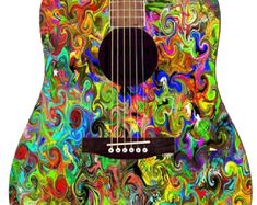 an acoustic guitar with colorful swirls painted on it