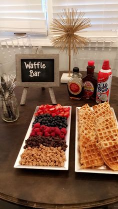 two white plates topped with waffles next to each other on top of a table