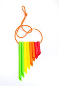 an orange string is attached to a rainbow colored instrument