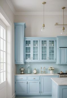 a kitchen with blue cabinets and white counter tops