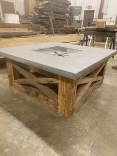 a table made out of wood and concrete