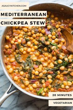 a pot filled with chickpea stew and spinach