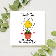 a greeting card with a smiling flower in a pot