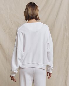 A relaxed fit with a dropped shoulder, cropped body length and clean cuffs with no distressing make this piece feel like the perfect deadstock sweatshirt flea market find. Authentic vintage details like a half moon in the back neck add extra character. Handcrafted locally in Los Angeles, our process ensures beauty and uniqueness—no two pieces are alike. 100% Cotton Machine Wash Cold, Tumble Dry Low Made in the U.S.A Crew Neck Boxy Fit Cropped Sweater For Loungewear, Casual Relaxed Fit Cropped Crew Sweater, Boxy Fit Crew Neck Cropped Sweater For Loungewear, Oversized Crew Neck Casual Cropped Sweater, Relaxed Fit Crew Cropped Sweater, Relaxed Fit Cotton Cropped Sweater For Everyday, Relaxed Fit Crew Neck Cropped Cotton Sweater, Cropped Boxy Sweater With Ribbed Cuffs And Crew Neck, Relaxed Fit Cropped Sweater With Ribbed Cuffs