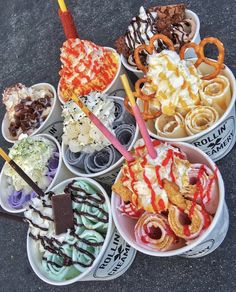 an assortment of ice creams and desserts in bowls