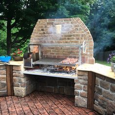 an outdoor bbq grill with lots of food cooking on the outside and in front