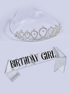 a tiara with the words birthday girl on it next to a ribbon that says happy birthday