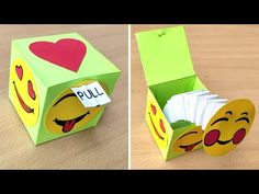 an origami box that has been made to look like a smiley face