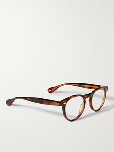 Find GARRETT LEIGHT Hercules Round-frame Acetate Optical Glasses on Editorialist. Garrett Leight California Optical's 'Hercules' optical glasses are inspired by the frames Andy Warhol wore. Made from tortoiseshell acetate, they have a keyhole bridge and engraved gold-tone metal at the temples. Browline Glasses Men, Spectacles Mens, Glass Frames For Men, Men's Glasses Frames, Glasses Inspo, Glasses Frames For Men, Mens Accessories Vintage, Mens Eye Glasses