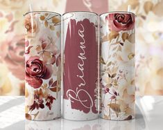 three different types of candles with flowers on them