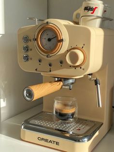 an espresso machine sitting on top of a counter