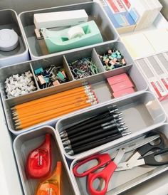 an organized drawer with scissors, pencils and other office supplies