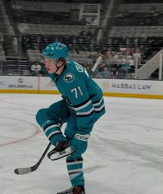 a hockey player is on the ice ready to play