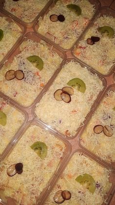 several plastic containers filled with food on top of a table