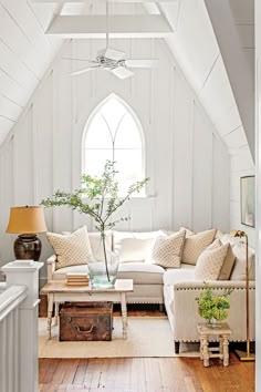 a living room filled with furniture and a window